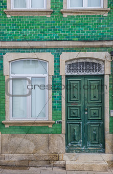 Old house with green tiles in Chaves