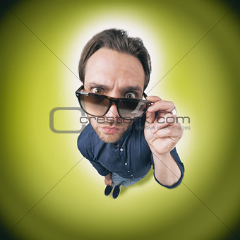 Funny man looking through his sunglasses