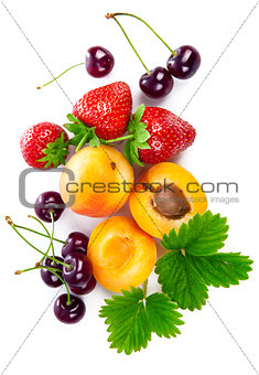 Fresh berries and fruits in still life, top view