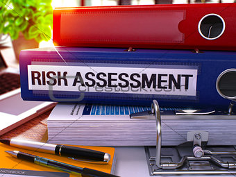 Risk Assessment on Blue Office Folder. Toned Image.