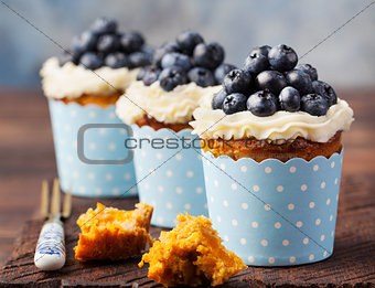 Pumpkin cupcakes with cream cheese, blueberries
