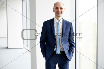 Smiling young businessman in the office