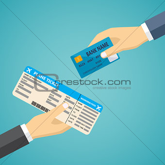 Hand with credit card and hand with boarding pass.