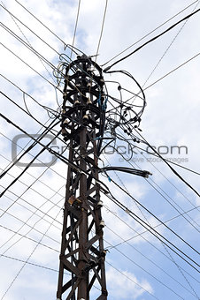 Many wires on an old electric pole