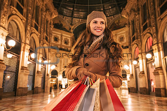 Woman with shopping bags in Galleria Vittorio Emanuele II
