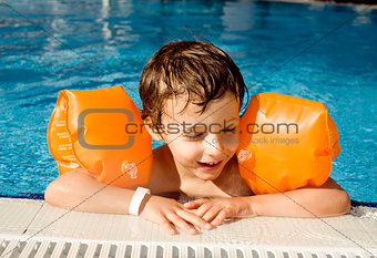 little cute boy in swimming pool close up smiling