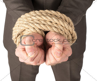 Businessman bound with rope
