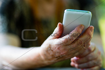 old woman holding a mobile phone