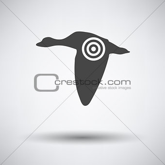 Flying duck  silhouette with target  icon