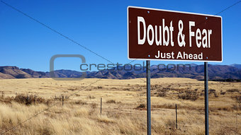 Doubt and Fear brown road sign brown road sign