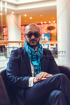 Businessman sitting on a sofa in the hotel
