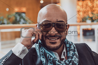 Arab businessman talking on mobile phone