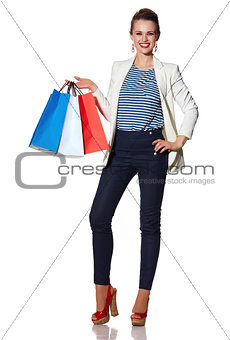 Portrait of smiling woman with French flag colours shopping bags