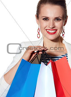 Close portrait of woman with French flag colours shopping bags