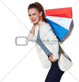 Happy young woman with French flag colours shopping bags