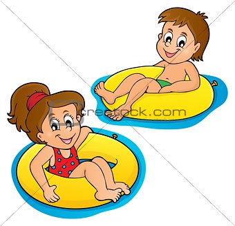 Children in swim rings image 1