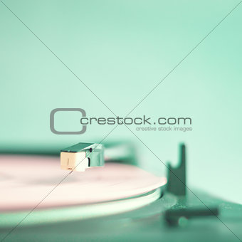 Vintage turntable and pink record