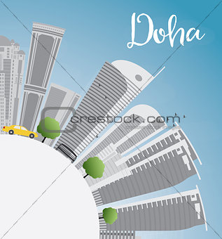 Doha skyline with grey skyscrapers and blue sky. 