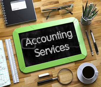 Accounting Services - Text on Small Chalkboard.