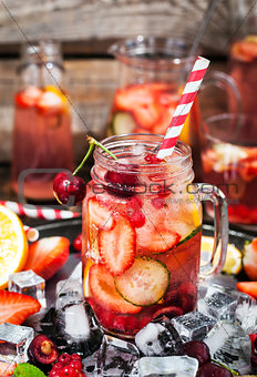 Healthy infused detox water with fresh berries and fruits