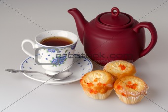 Cup of tea, teapot and cake