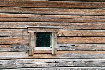 Small window on log wall
