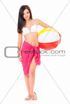 Woman in swimsuit with beach ball