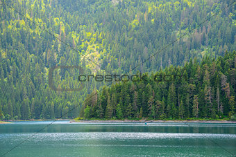 Beautiful Black Lake, Green Forest and Beautiful Mountains in the Morning. National Park Durmitor, Montenegro