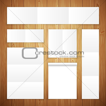 Set of White Banners on Wooden Surface