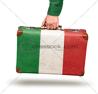 Male hand holding vintage Italian flag suitcase
