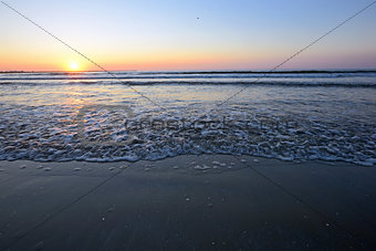 Radiant sea beach sunrise