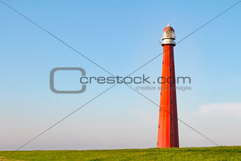 Beautiful Red Lighthouse under a blue sky