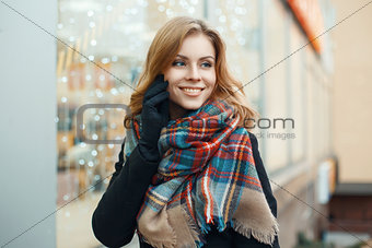 Pretty woman with a sweet smile makes the Christmas shopping