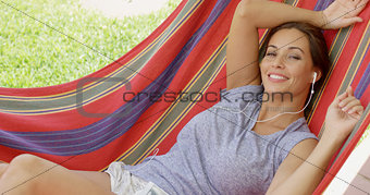 Blissful young woman relaxing listening to music