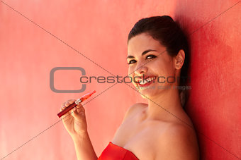 Portrait Girl Smiles Electronic Cigarette E-Cig Against Red Back