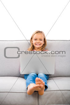 Little girl working with a laptop