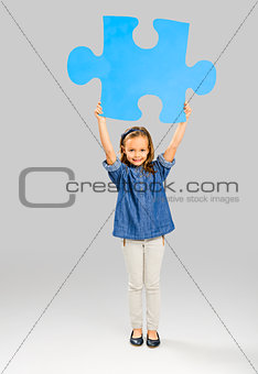 Girl holding a puzzle