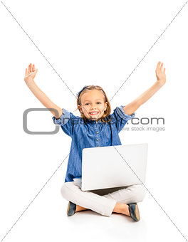 Little girl working with a laptop