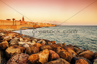 Alghero, Sardinia: skyline with defensive walls in the sunset