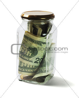 US Dollars Bills and Coins in Glass Jar