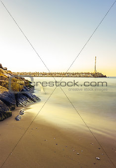 Sea landscape with a lighthouse in the port