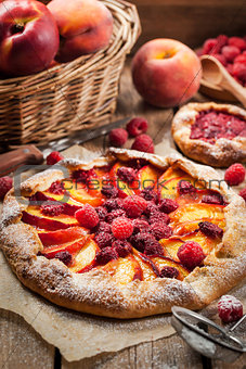 Rustic open pie with peach and raspberry
