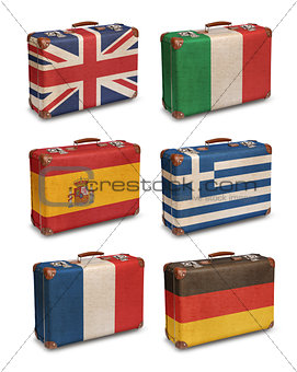 Vintage suitcases with European flags on white