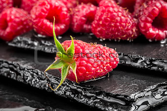 Delicious red raspberry on a slate table