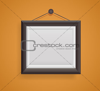 blank picture frame template hanging on orange wall