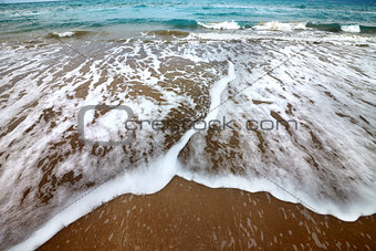 Sea beach with waves in autumn