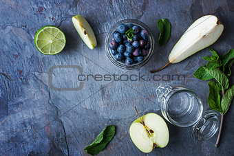 Ingredients for smoothie from apple, pear and blueberry