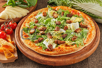 Pizza with meat and salad