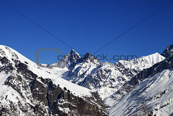 Mountain peaks in winter at sunny day