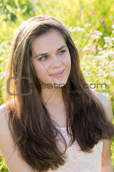 girl with beautiful long hair resting on nature